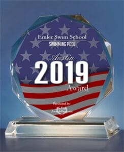 Emler Swim School's glass award for 2019 Austin award in the Swimming Pool category